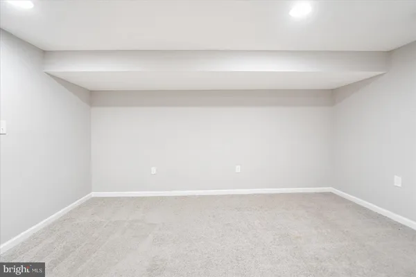 a view of an empty room with stairs