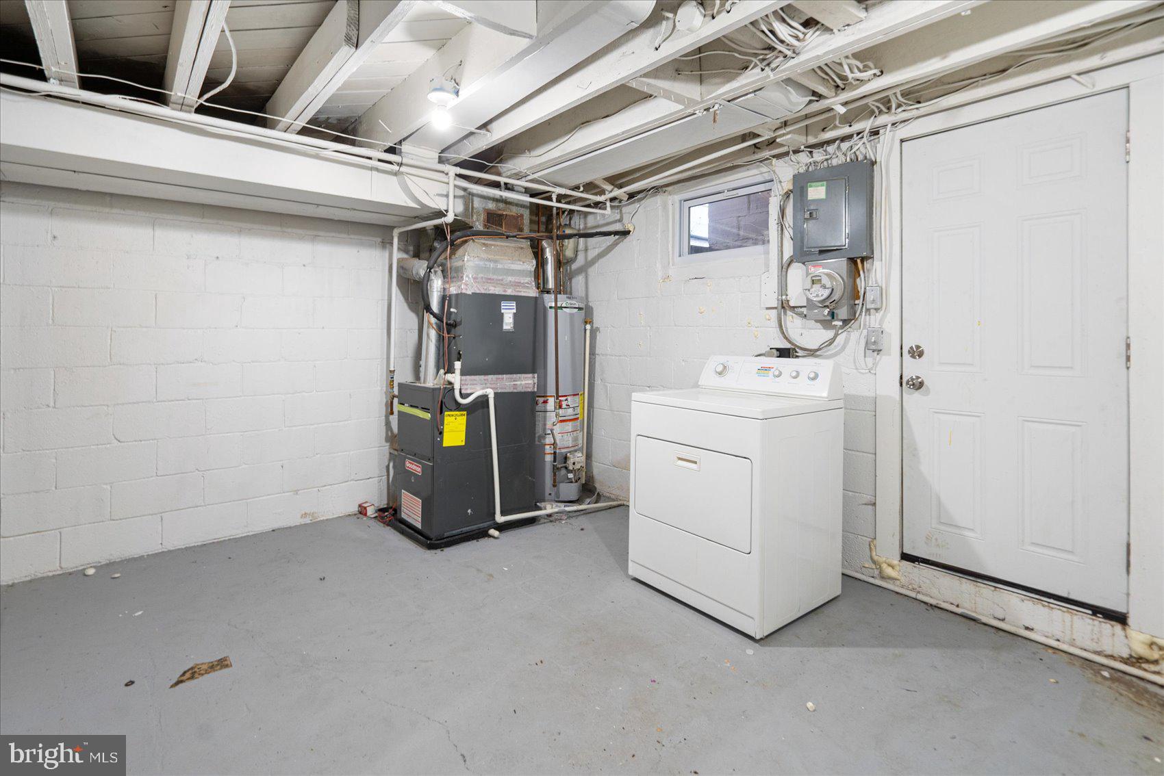 706 Norris Lane Baltimore, MD 21221 - Photo 23 of 36 a view of storage and utility room with washer and dryer