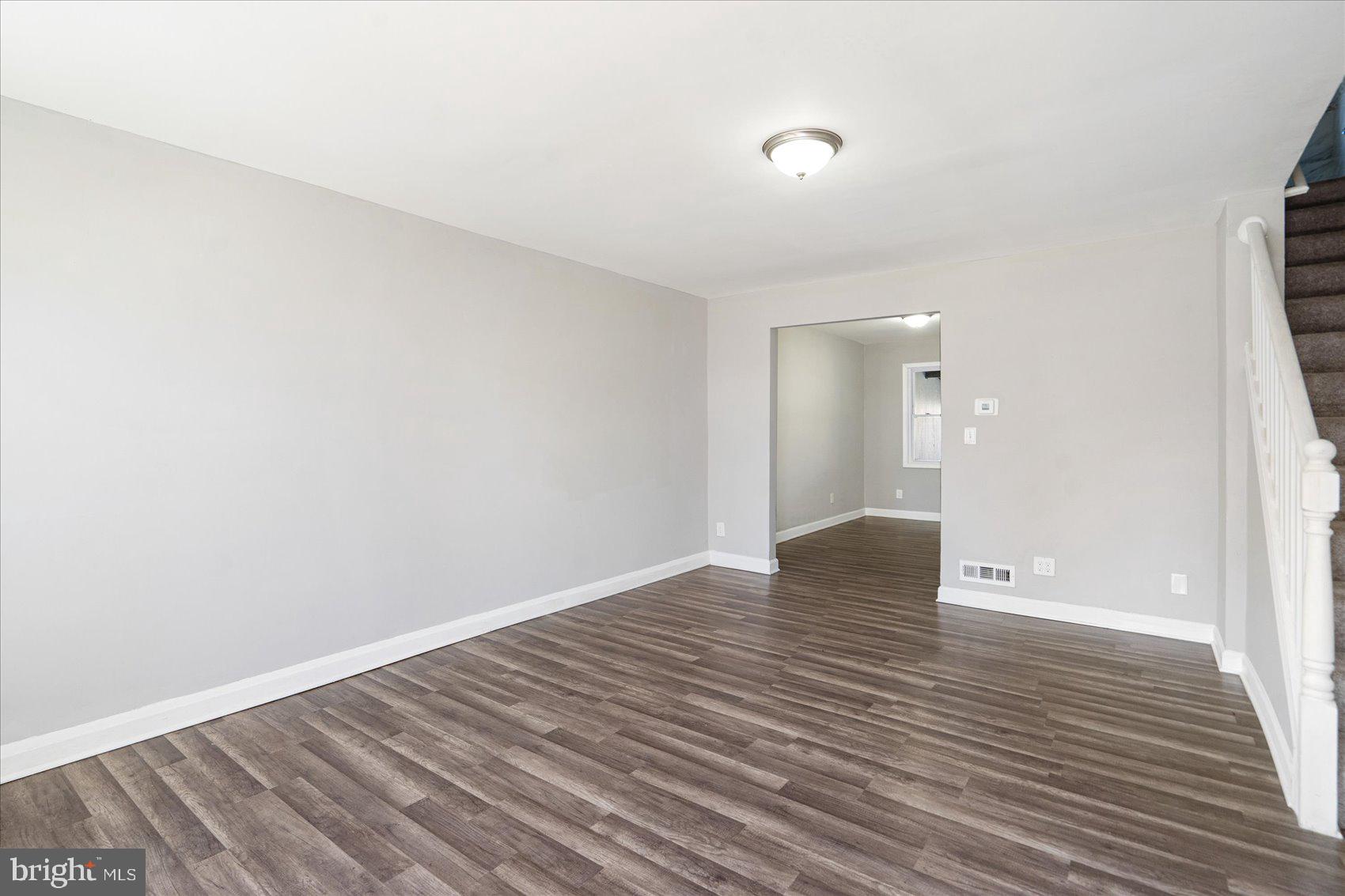 706 Norris Lane Baltimore, MD 21221 - Photo 9 of 36 a view of an empty room with wooden floor