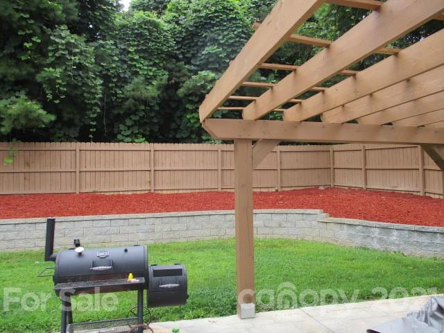 11002 Pointer Ridge Drive Charlotte, NC 28214 - Photo 2 of 2 a view of backyard with seating area and green space