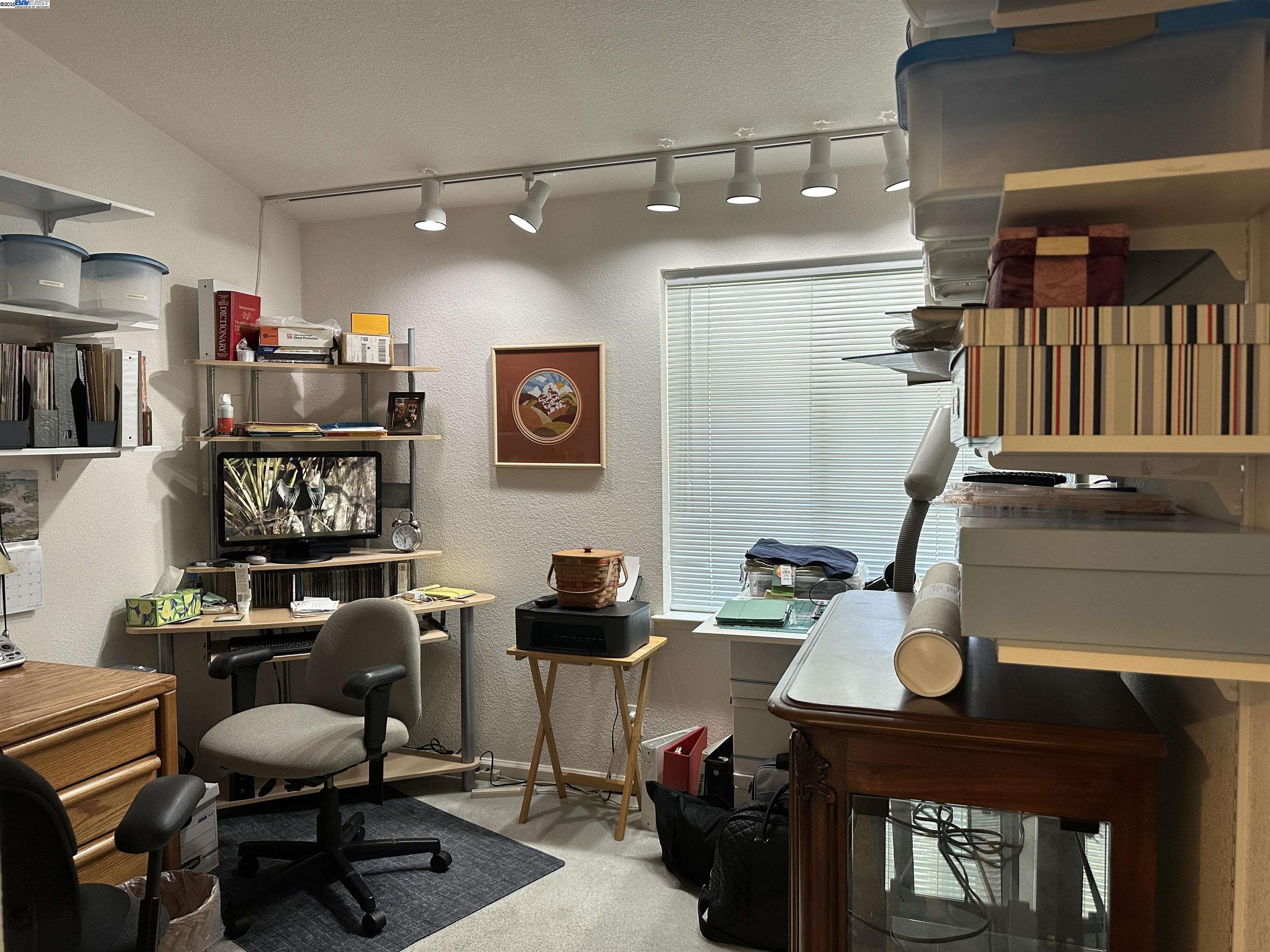 711 Old Canyon Road, Unit 103 Fremont, CA 94536 - Photo 17 of 38 a work room with furniture and wooden floor