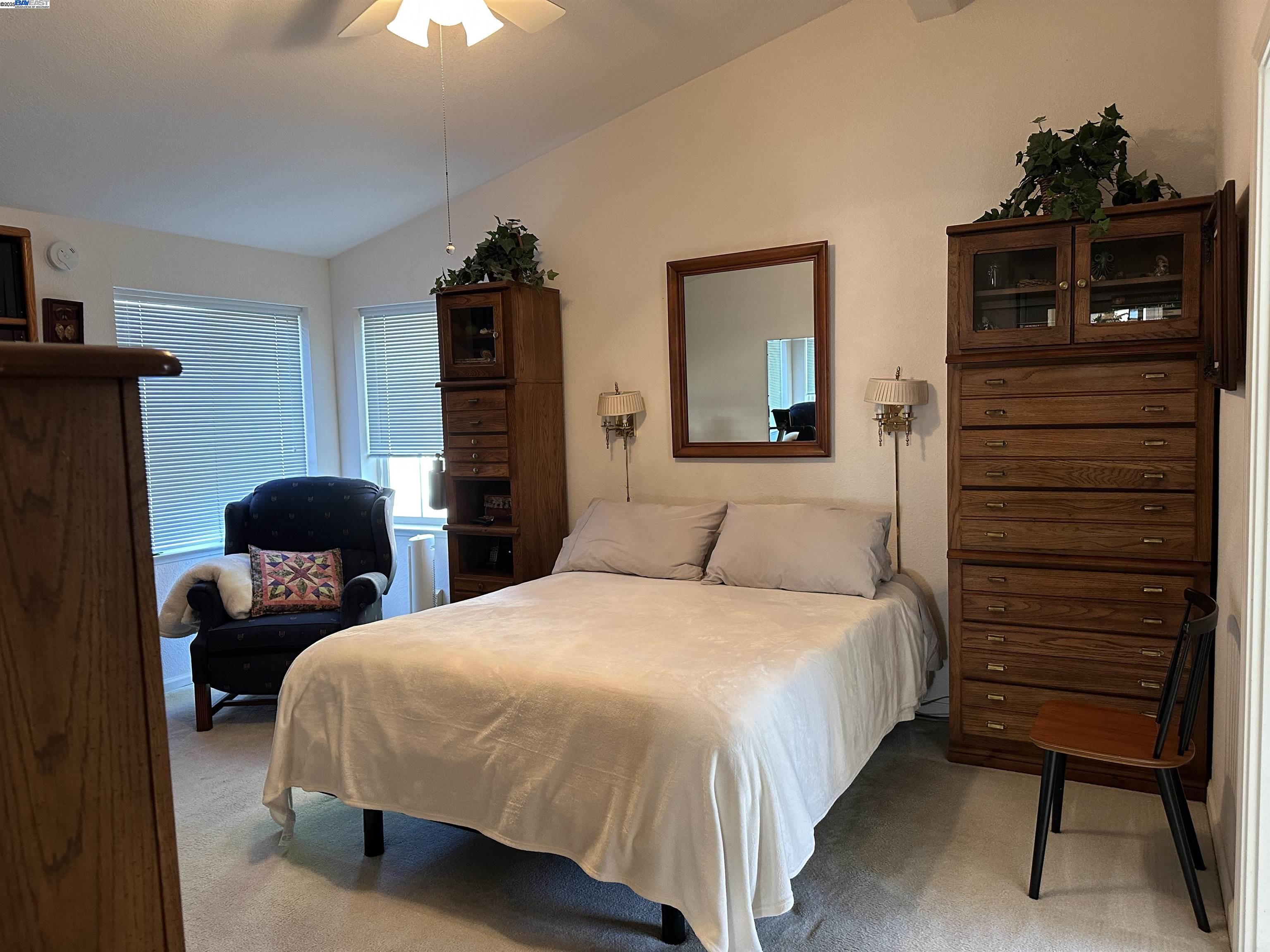 711 Old Canyon Road, Unit 103 Fremont, CA 94536 - Photo 21 of 38 a bedroom with a bed and a dresser