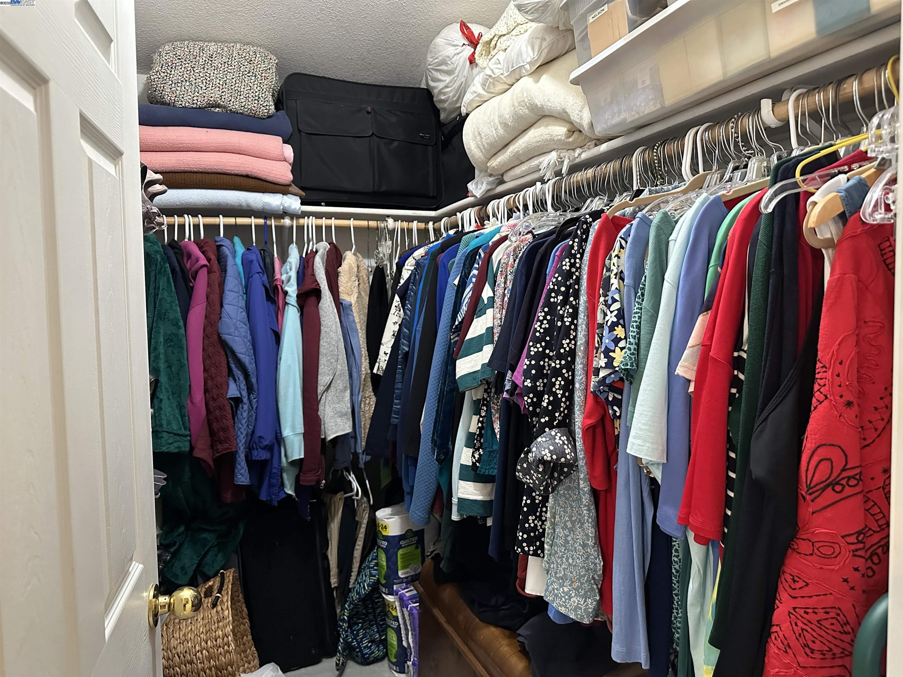711 Old Canyon Road, Unit 103 Fremont, CA 94536 - Photo 23 of 38 a view of walk in closet with clothes and shoes