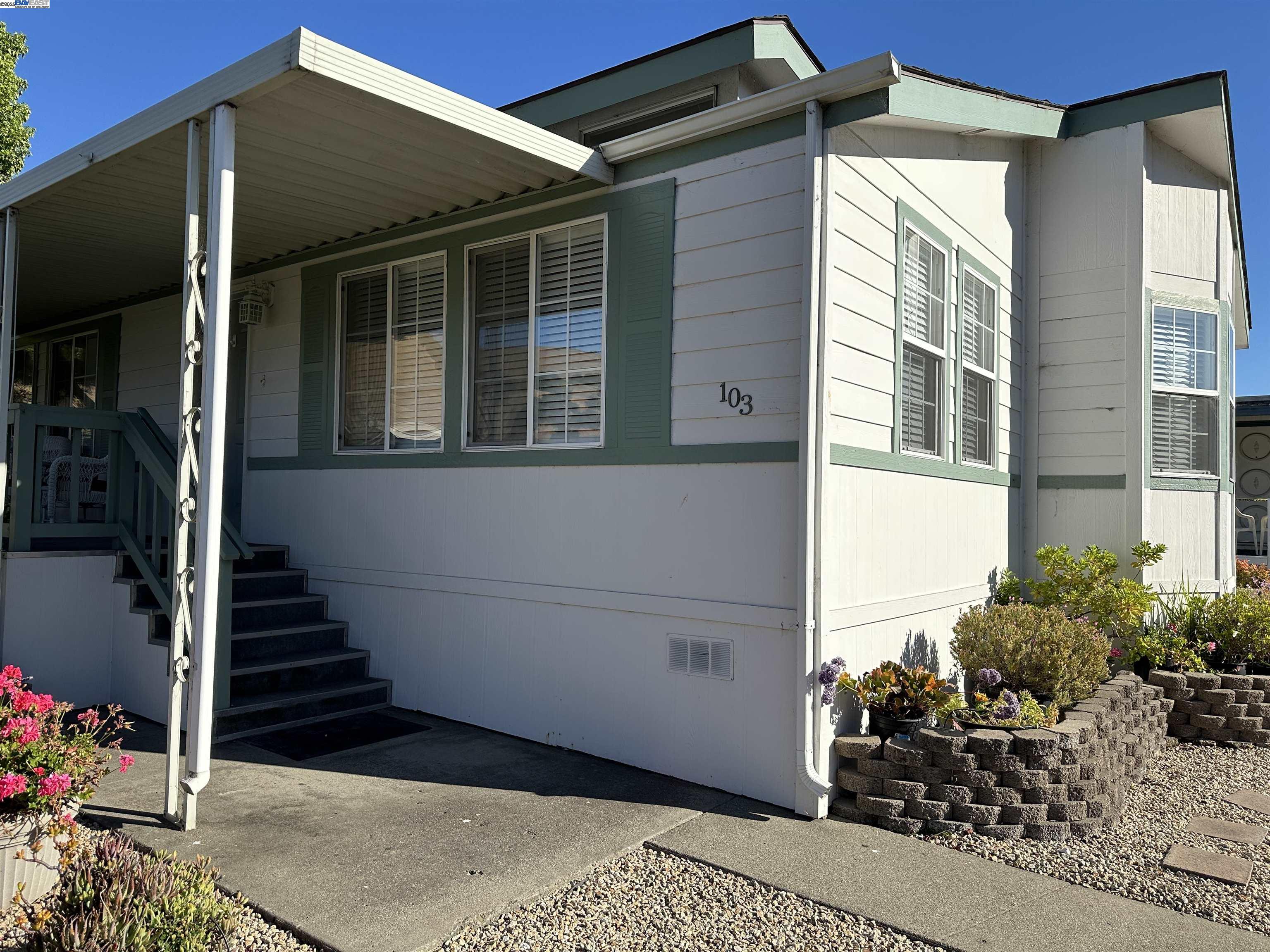 711 Old Canyon Road, Unit 103 Fremont, CA 94536 - Photo 27 of 38 a view of a house with entryway and flower windows