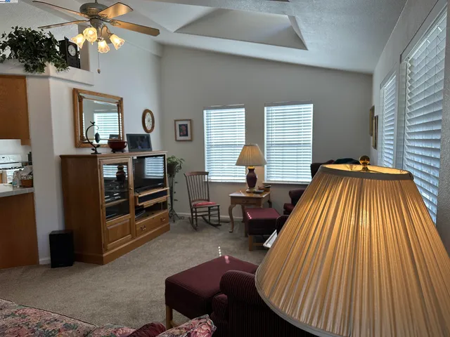 a bed room with furniture and a window