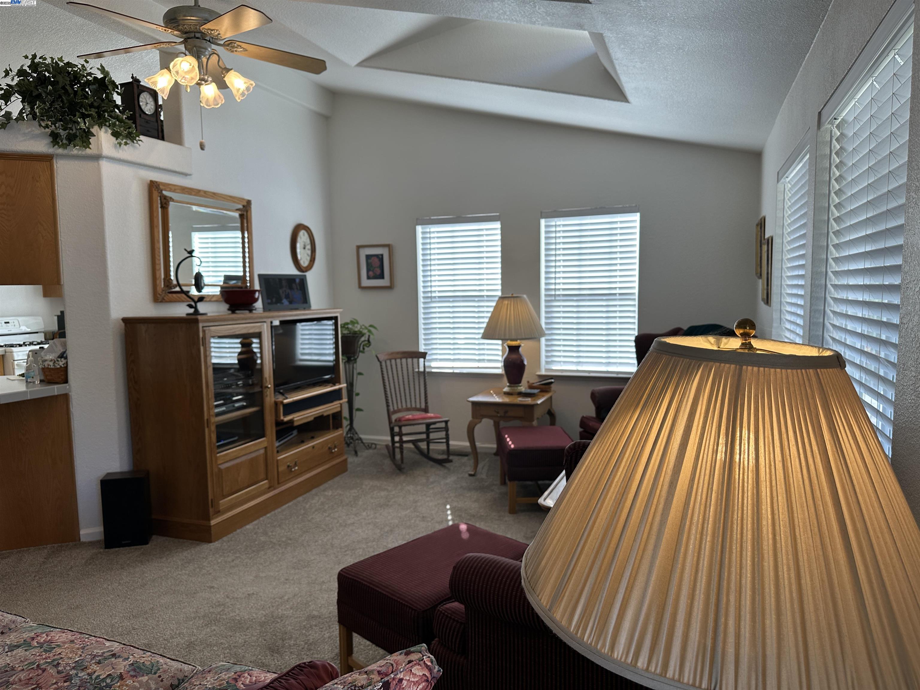 711 Old Canyon Road, Unit 103 Fremont, CA 94536 - Photo 6 of 38 a bedroom with a bed and wooden floor