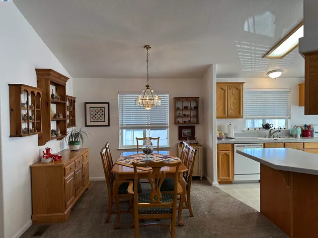 a kitchen with stainless steel appliances a sink stove and cabinets
