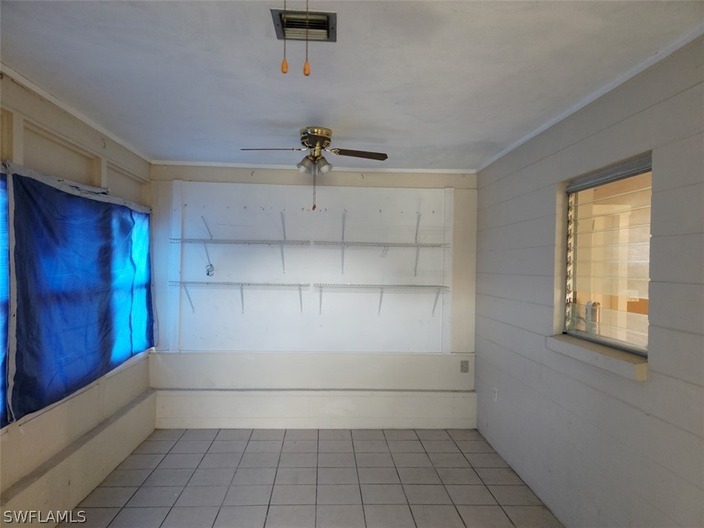 114 Florida Road Lehigh Acres, FL 33936 - Photo 12 of 12 a view of an empty room and a window