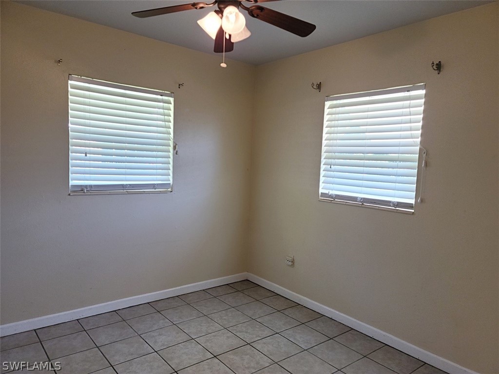 114 Florida Road Lehigh Acres, FL 33936 - Photo 7 of 12 an empty room with a window