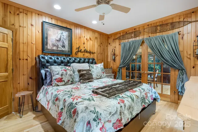 a bathroom with a granite countertop toilet a sink a mirror and a window