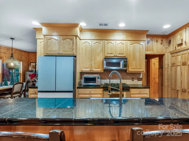a bedroom with bed and wooden floor