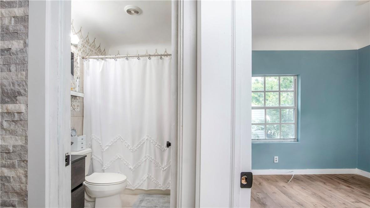 2221 Harding Street Hollywood, FL 33020 - Photo 14 of 30 a bathroom with a toilet and a shower