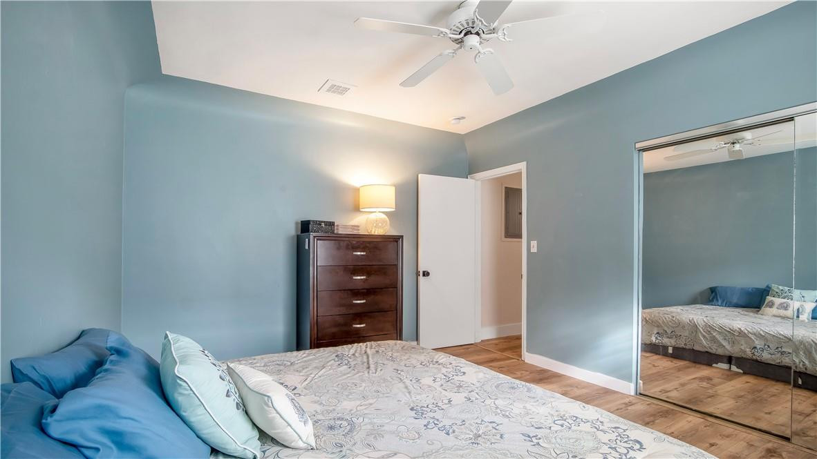 2221 Harding Street Hollywood, FL 33020 - Photo 16 of 30 a bedroom with a bed and a mirror