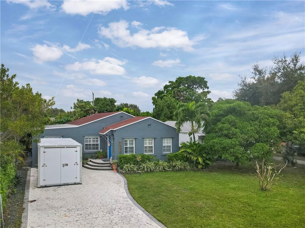 2221 Harding Street Hollywood, FL 33020 - Photo 27 of 30 a front view of a house with garden