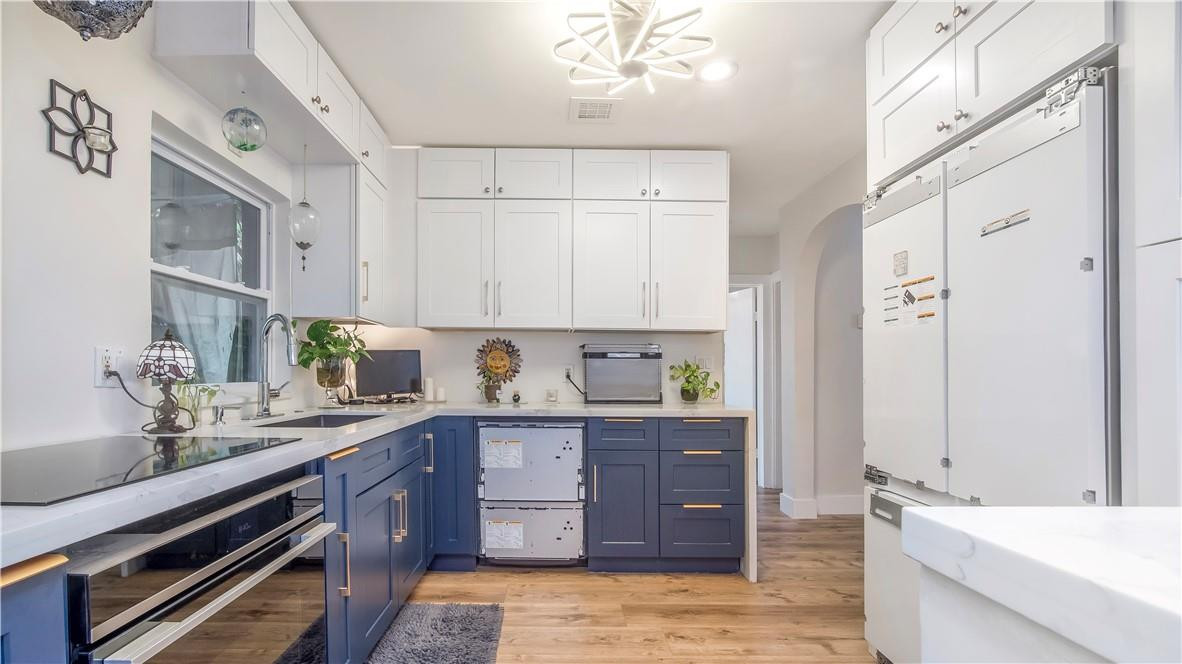 2221 Harding Street Hollywood, FL 33020 - Photo 6 of 30 a kitchen with a sink and cabinets