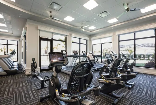 a very nice looking living room with furniture and floor to ceiling windows