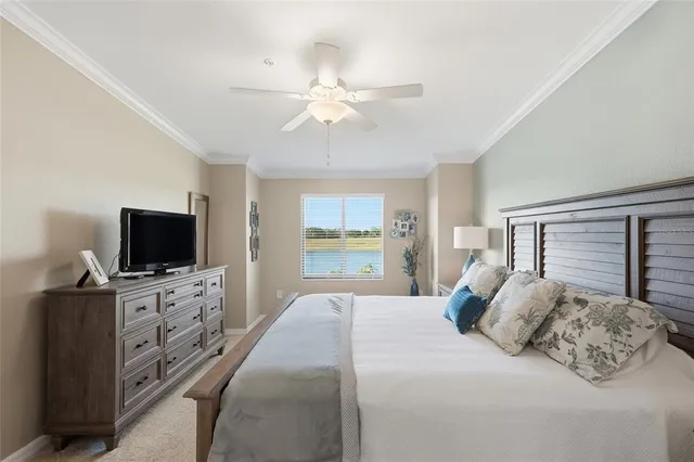 a bedroom with a large bed and a flat screen tv