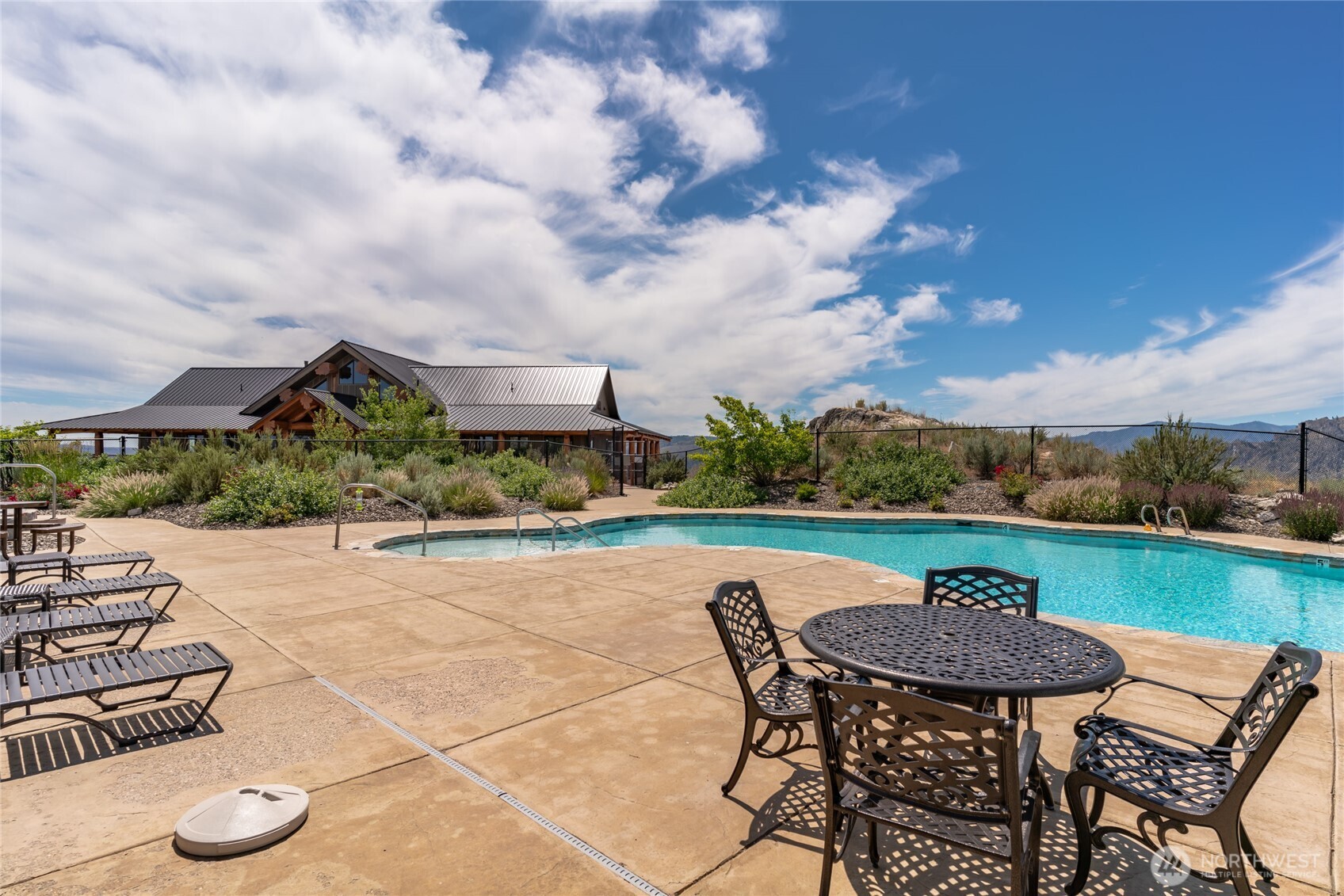 1 Gunsmoke Road Brewster, WA 98812 - Photo 12 of 29 a view of a swimming pool and lounge chairs