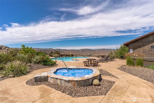 a view of a swimming pool with a yard