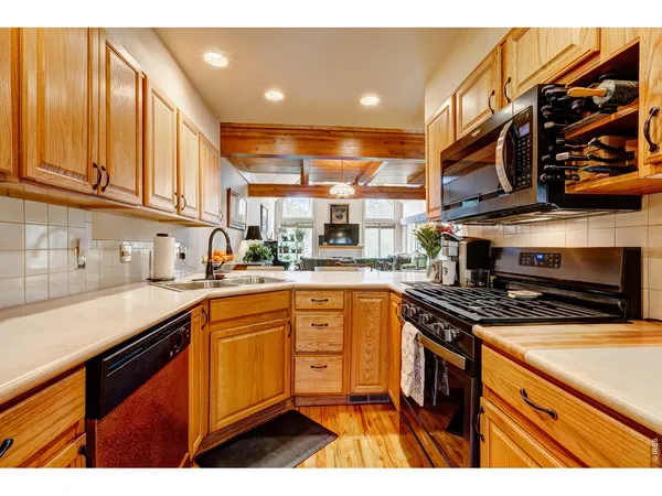 a view of a living room and kitchen