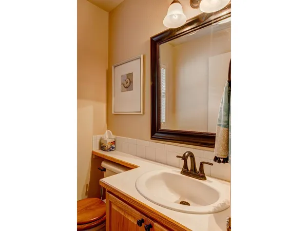 a bedroom with a bed closet and a flat tv screen