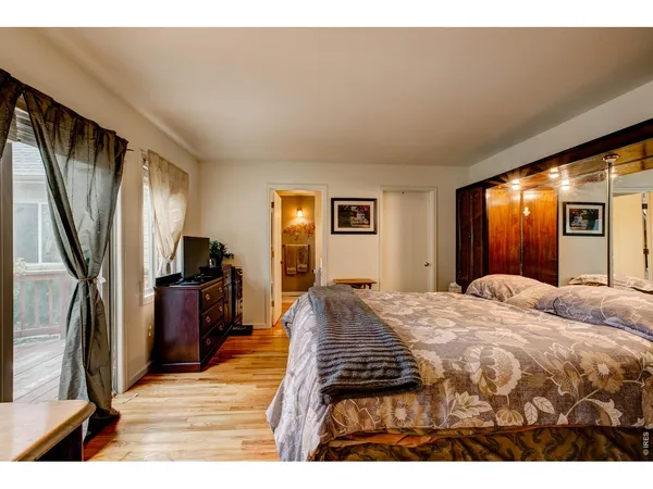 a bathroom with a double vanity sink a mirror and a bathtub