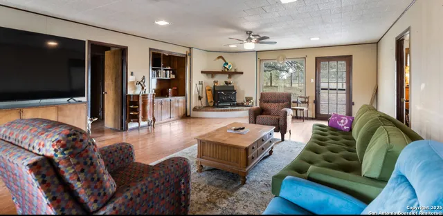 a living room with furniture and a rug