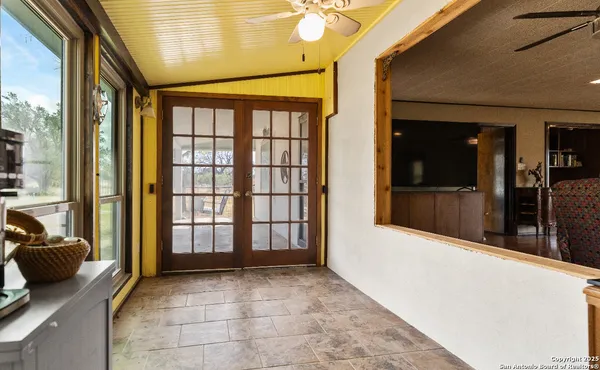 a living room with furniture and windows