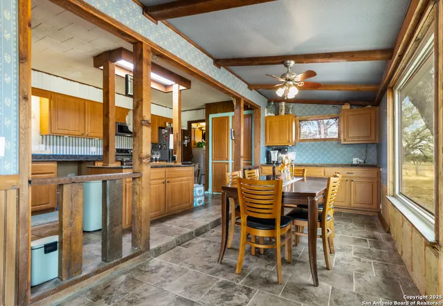 a kitchen with stainless steel appliances granite countertop a stove and a refrigerator