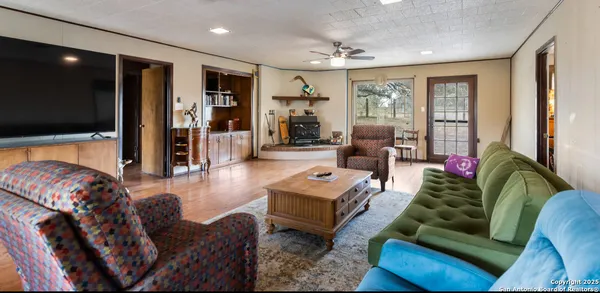 a living room with furniture and a rug