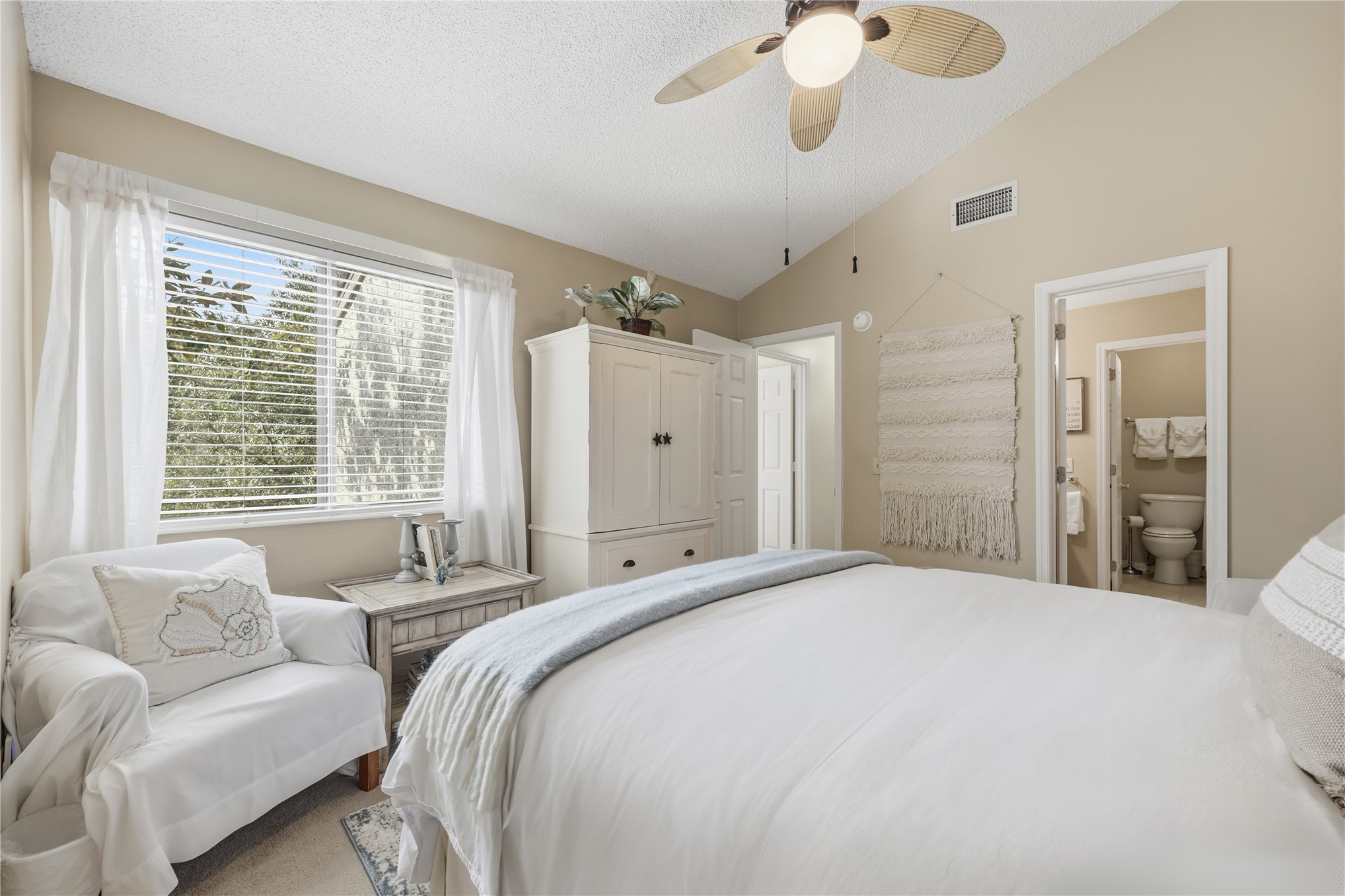 2886 Forest Ridge Drive, Unit U6 Fernandina Beach, FL 32034 - Photo 22 of 43 a spacious bedroom with a large bed couch and windows