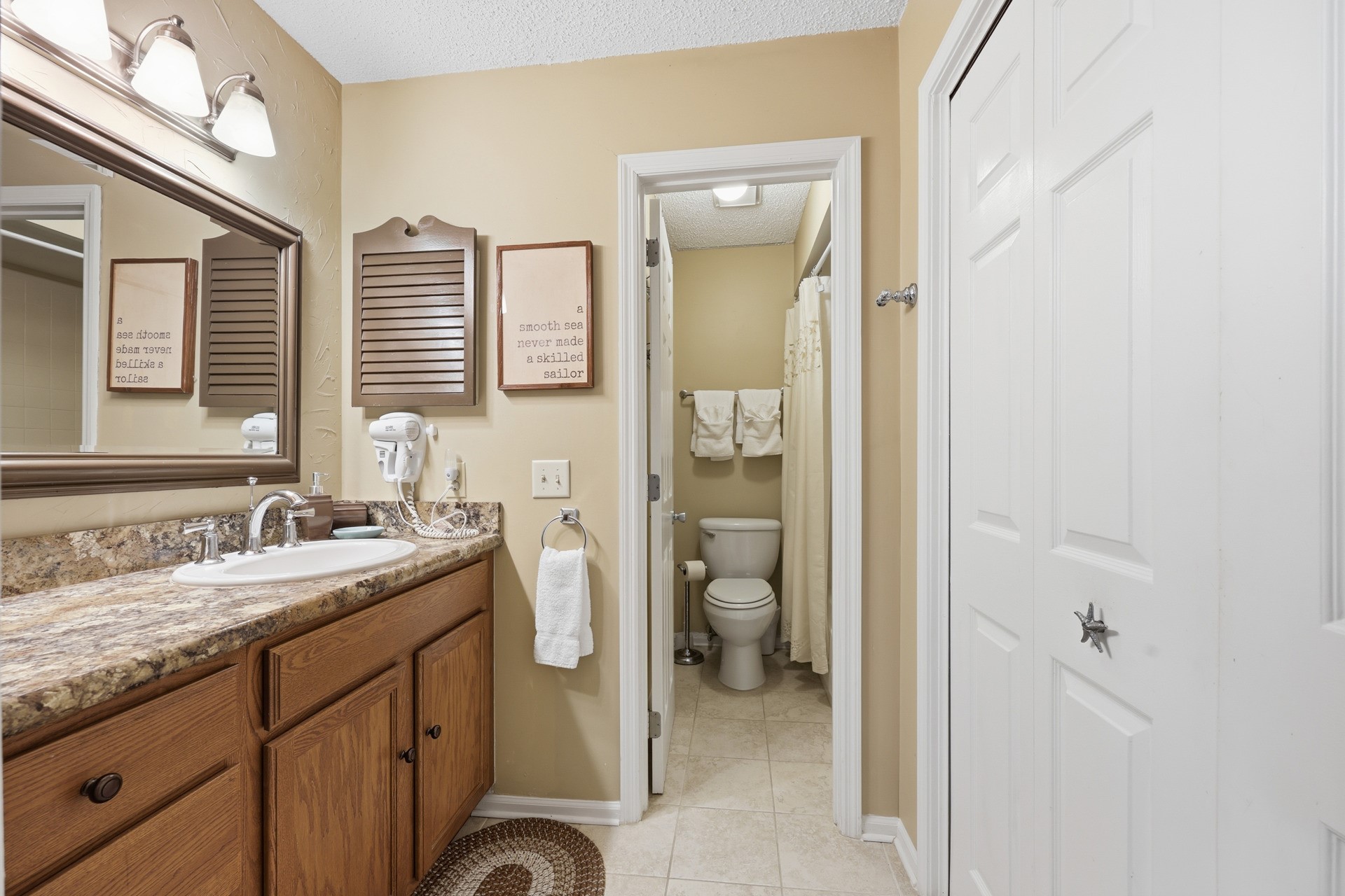 2886 Forest Ridge Drive, Unit U6 Fernandina Beach, FL 32034 - Photo 24 of 43 a spacious bathroom with a granite countertop sink mirror and a toilet
