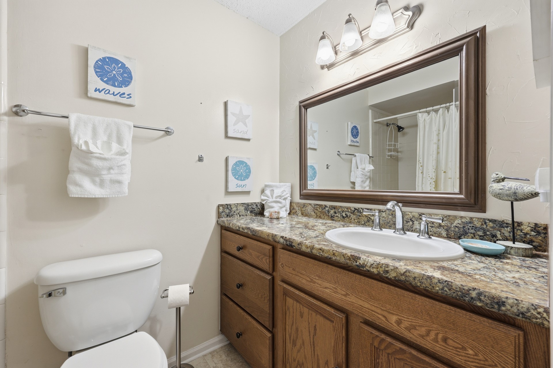 2886 Forest Ridge Drive, Unit U6 Fernandina Beach, FL 32034 - Photo 27 of 43 a bathroom with a granite countertop toilet sink and mirror