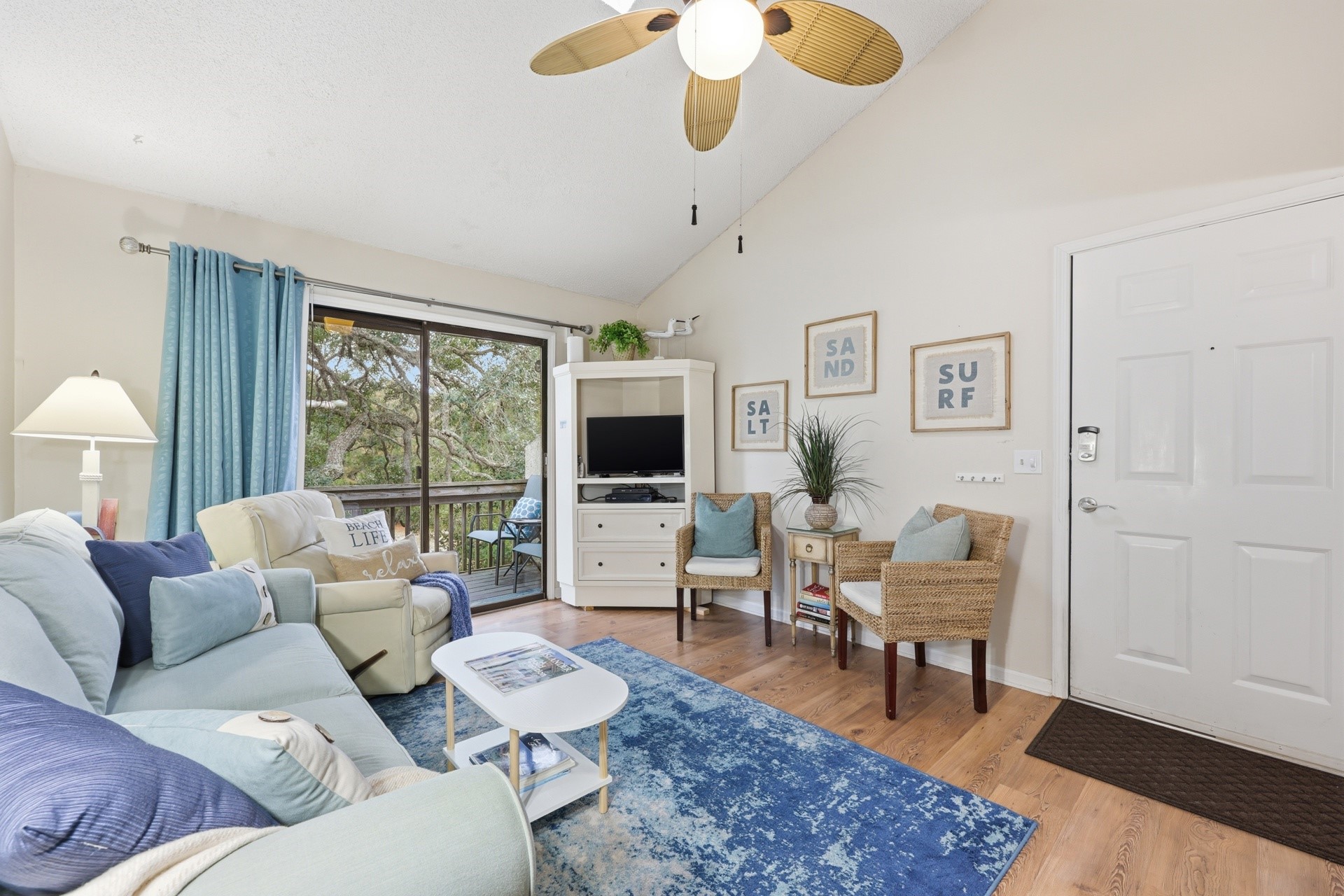2886 Forest Ridge Drive, Unit U6 Fernandina Beach, FL 32034 - Photo 8 of 43 a living room with furniture wooden floor and a flat screen tv