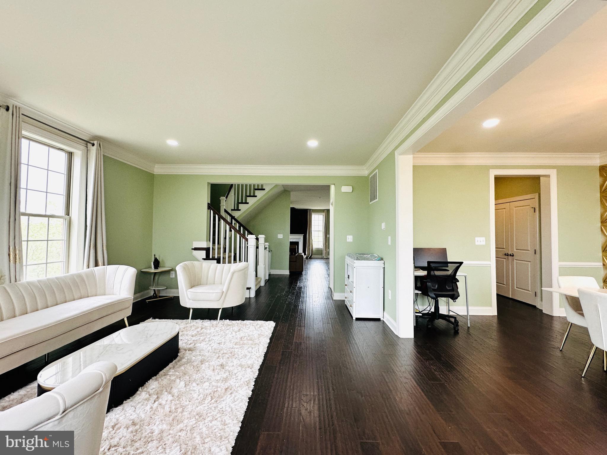 22611 Windsor Locks Square Ashburn, VA 20148 - Photo 16 of 53 a living room with furniture and a wooden floor