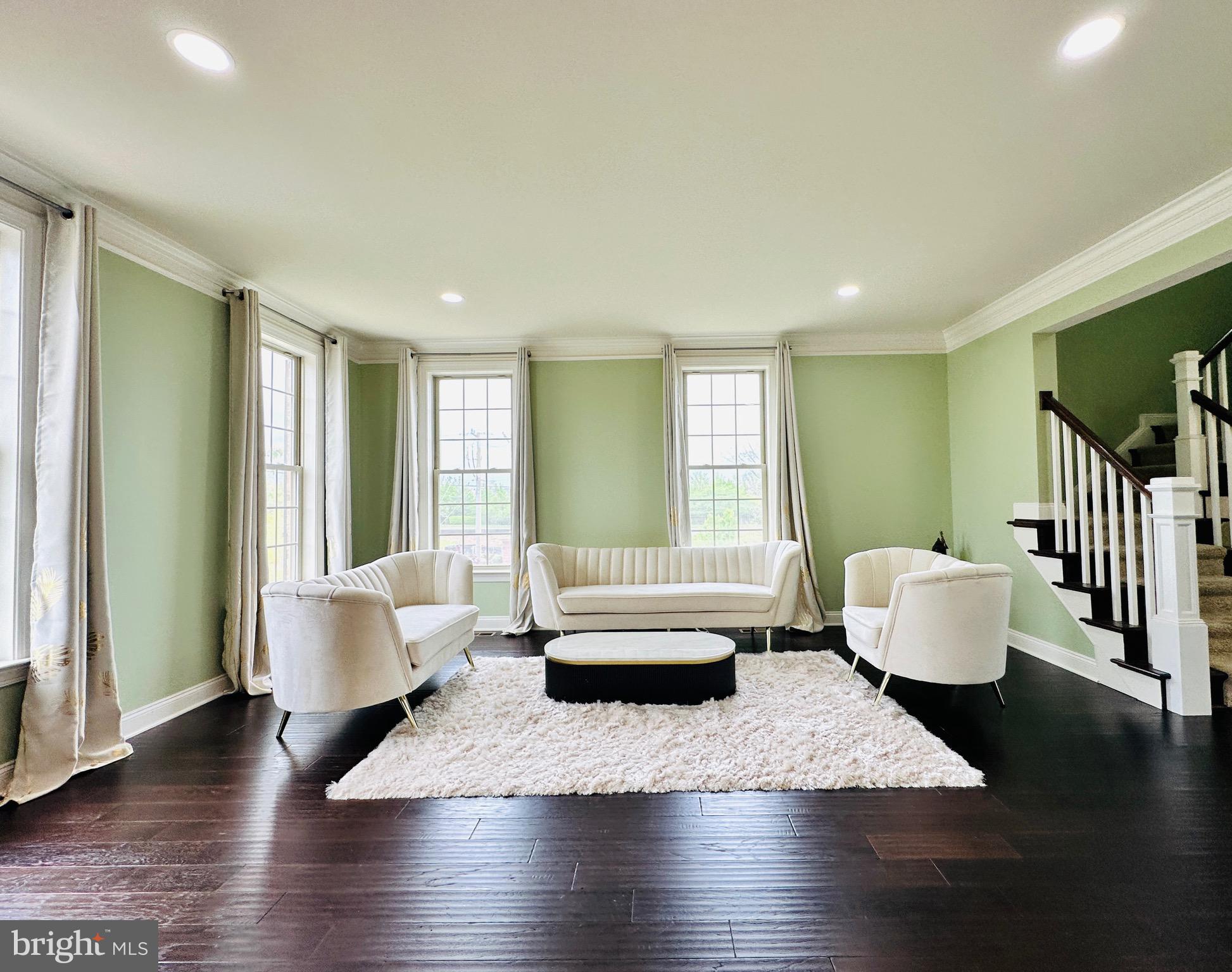 22611 Windsor Locks Square Ashburn, VA 20148 - Photo 17 of 53 a living room with furniture and wooden floor