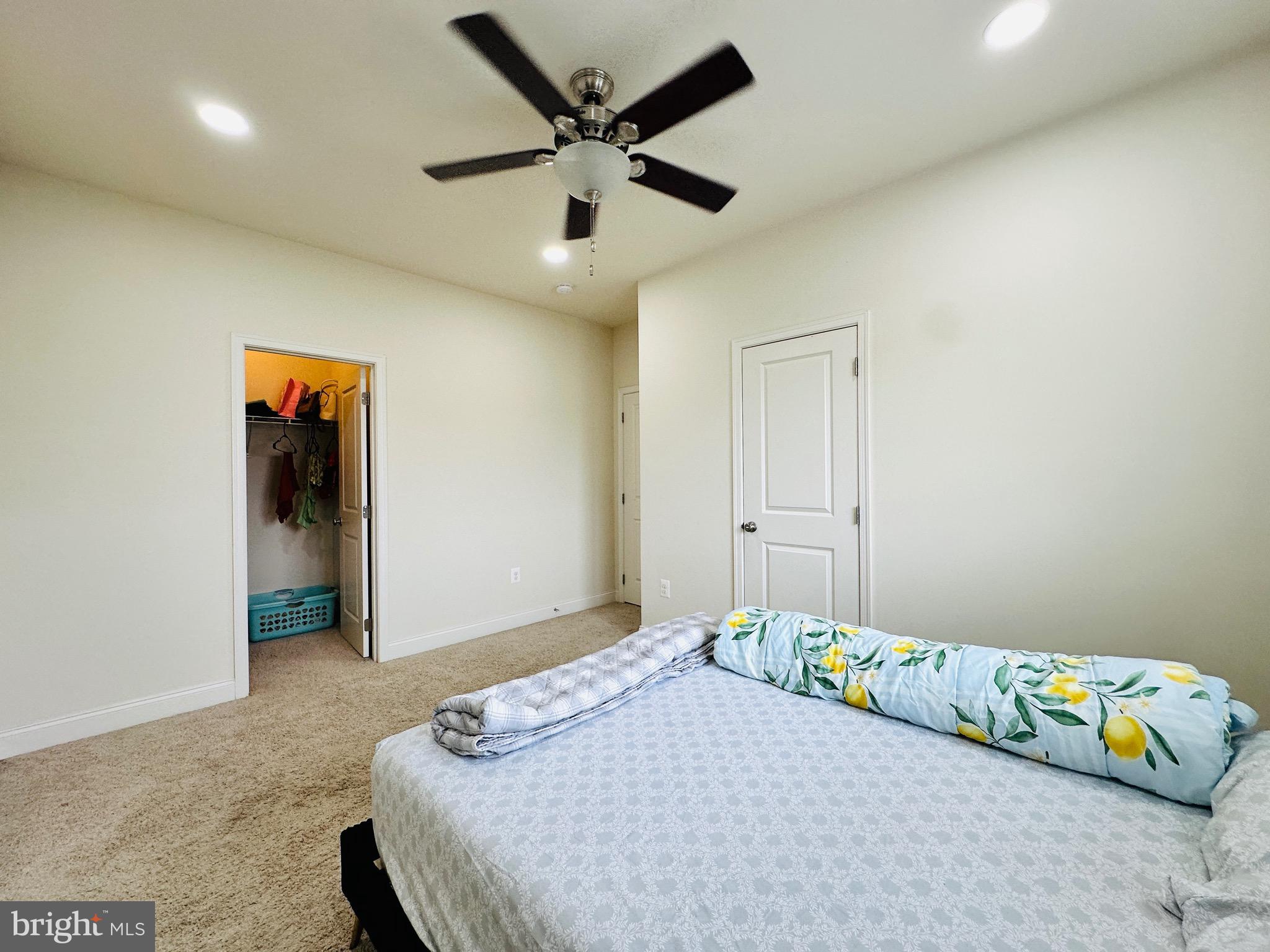 22611 Windsor Locks Square Ashburn, VA 20148 - Photo 20 of 53 a bedroom with a bed and a ceiling fan