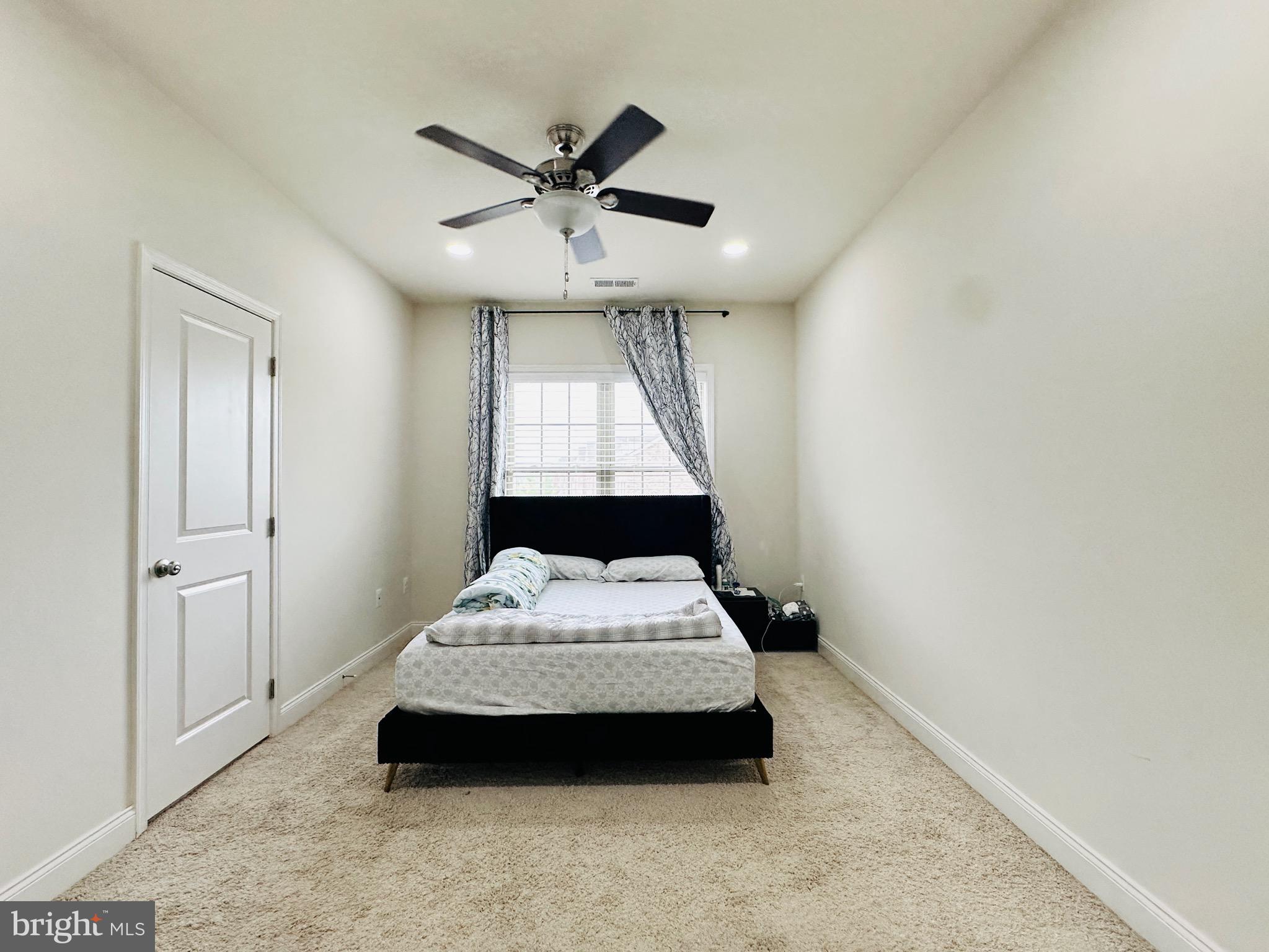 22611 Windsor Locks Square Ashburn, VA 20148 - Photo 22 of 53 a bedroom with a bed and a window
