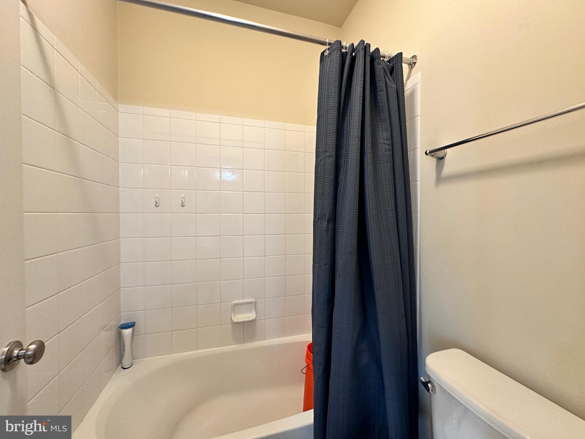 22611 Windsor Locks Square Ashburn, VA 20148 - Photo 23 of 53 a bathroom with a shower and a toilet