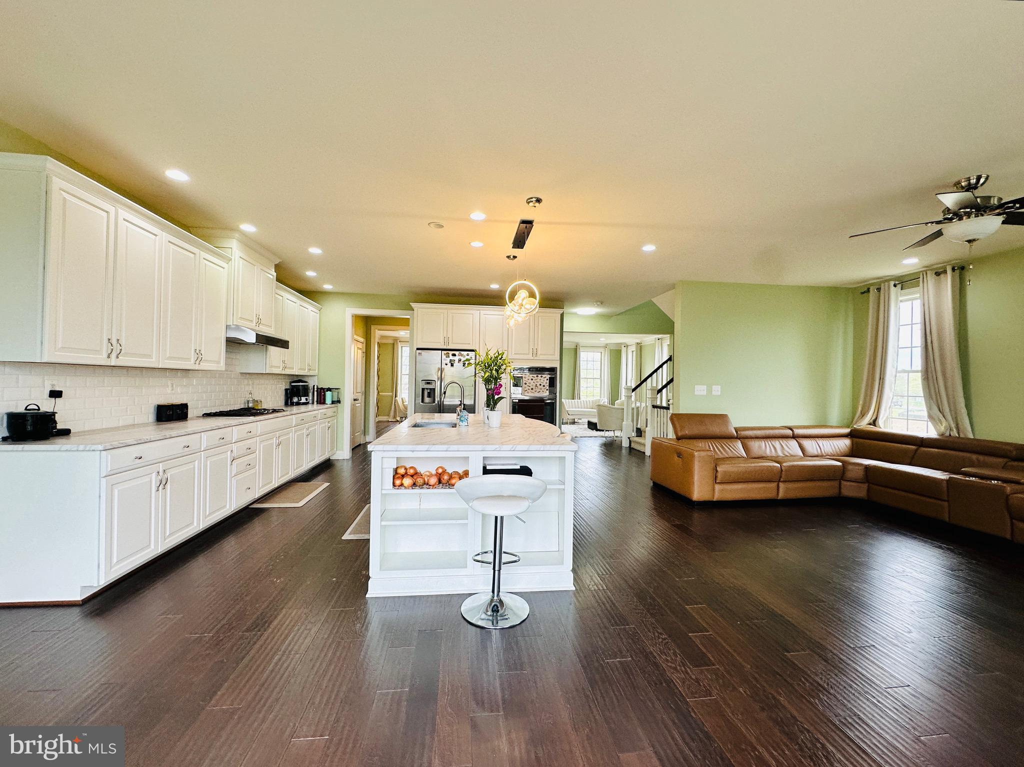 22611 Windsor Locks Square Ashburn, VA 20148 - Photo 3 of 53 a living room with furniture and a wooden floor