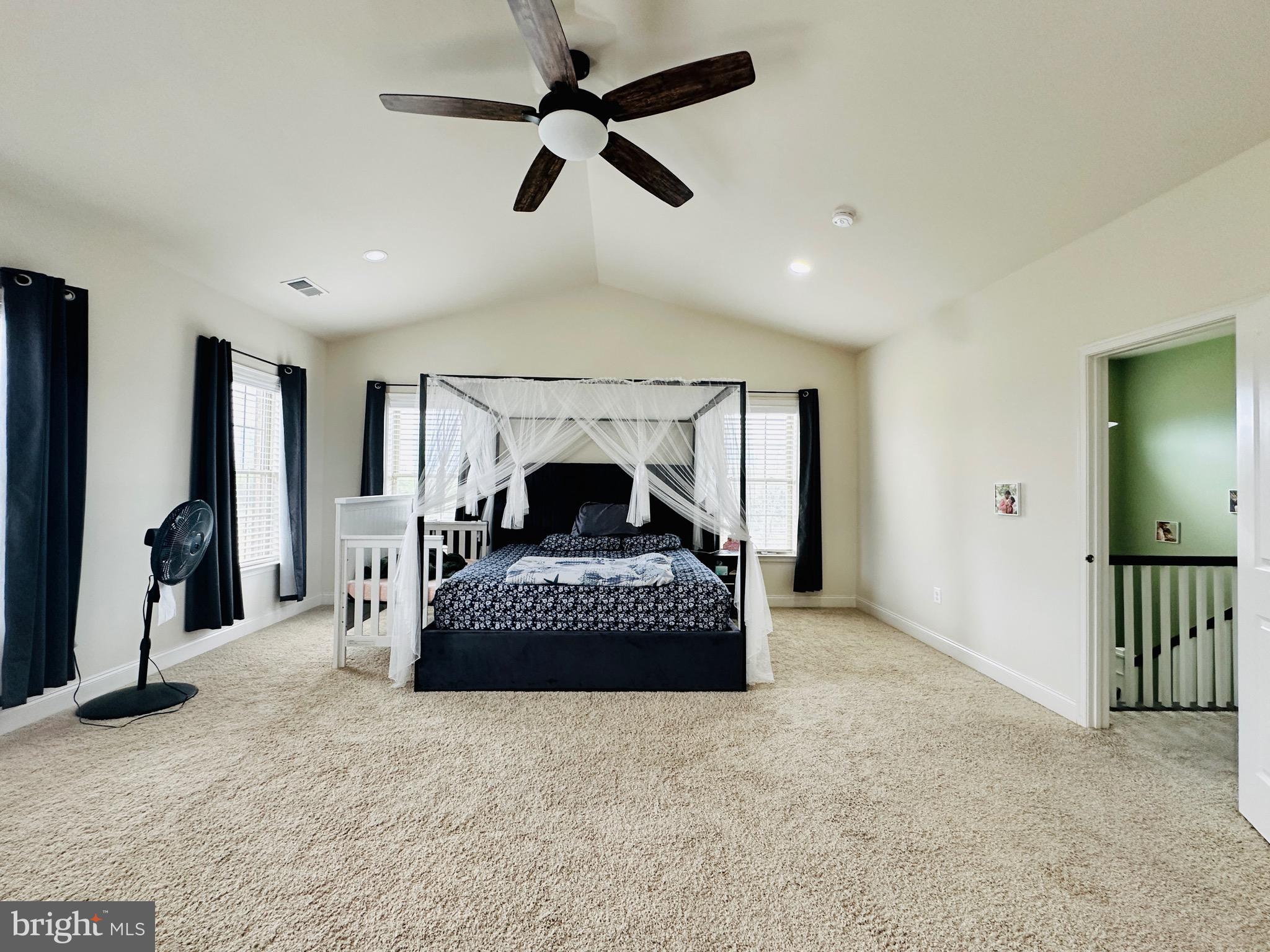 22611 Windsor Locks Square Ashburn, VA 20148 - Photo 35 of 53 a living room with furniture a ceiling fan and a rug