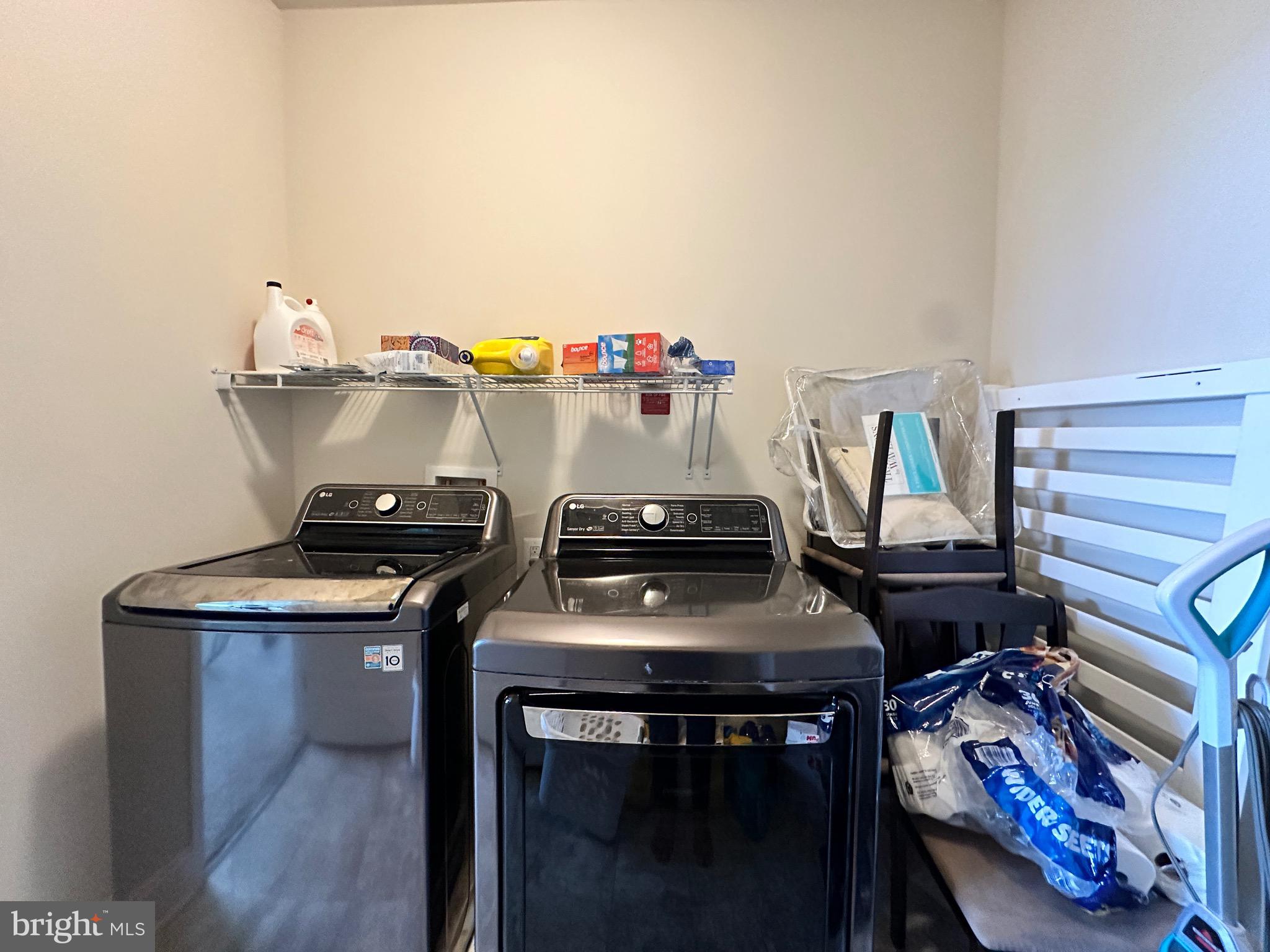22611 Windsor Locks Square Ashburn, VA 20148 - Photo 39 of 53 a utility room with dryer and stove