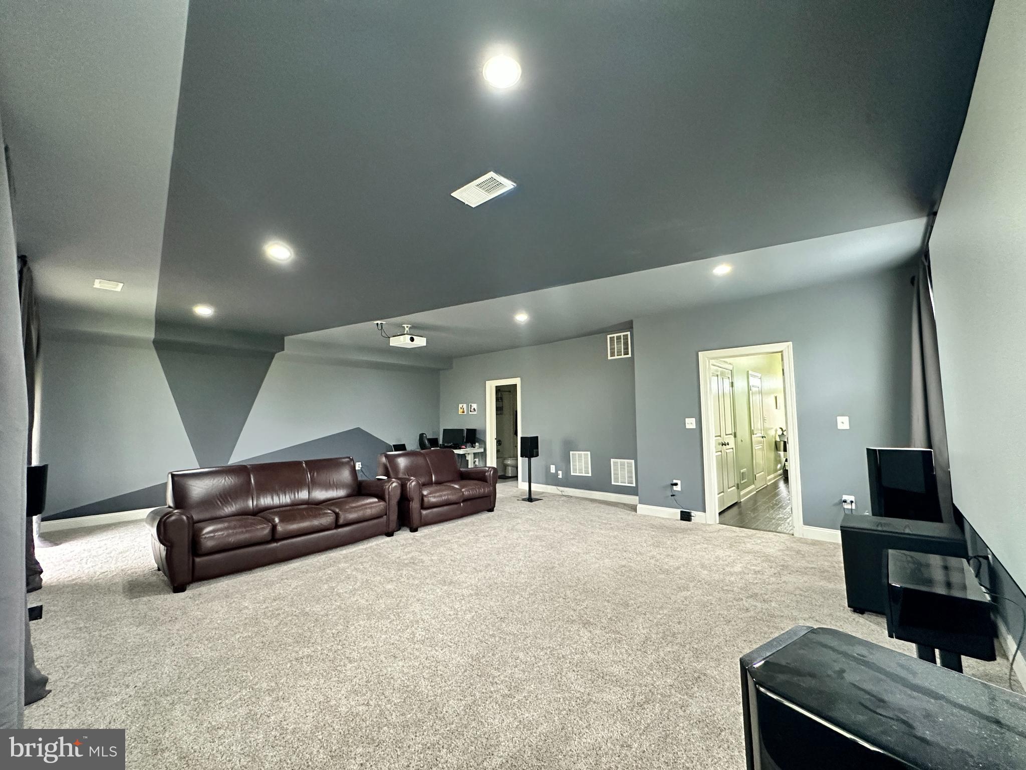 22611 Windsor Locks Square Ashburn, VA 20148 - Photo 44 of 53 a living room with furniture and a flat screen tv