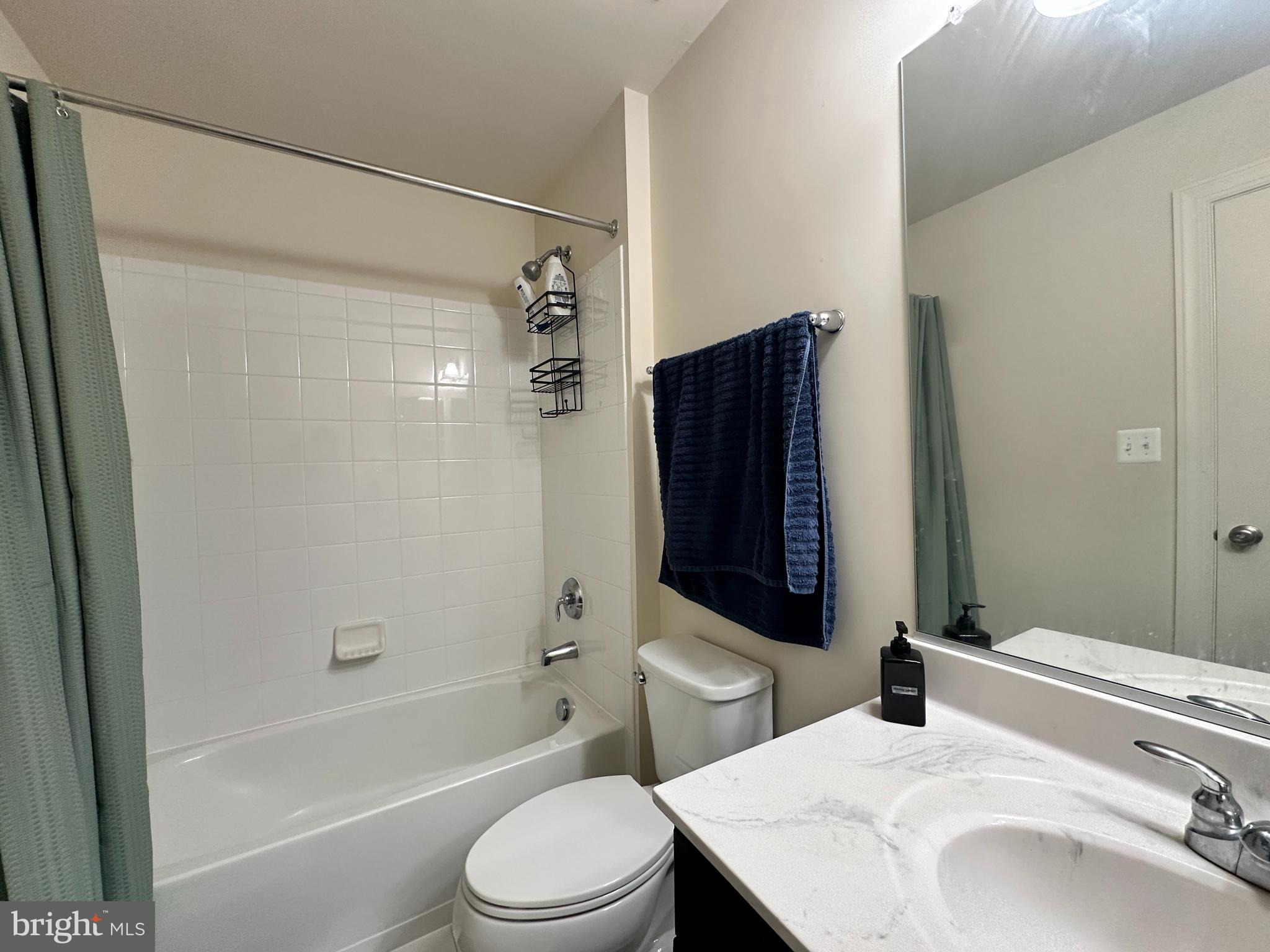 22611 Windsor Locks Square Ashburn, VA 20148 - Photo 48 of 53 a bathroom with a sink toilet and shower