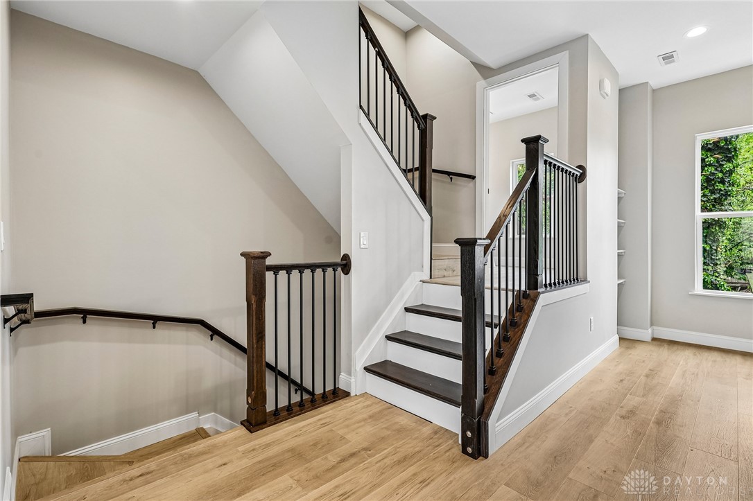 3906 Edwards Road, Unit C Cincinnati, OH 45209 - Photo 22 of 46 This interior offers a captivating visual journey between levels with warm, inviting flooring.