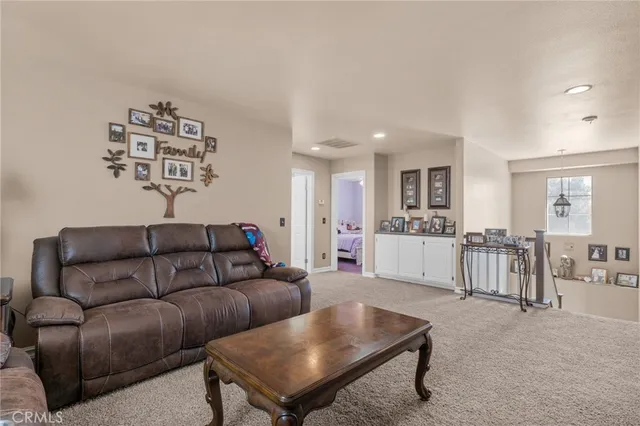 a living room with furniture and a table