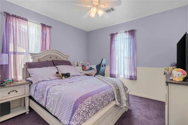 a bedroom with bed and window