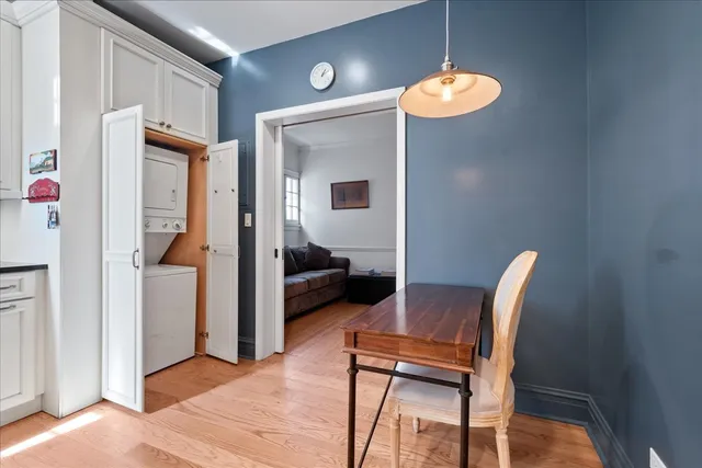 a view of dining room with furniture and wooden floor