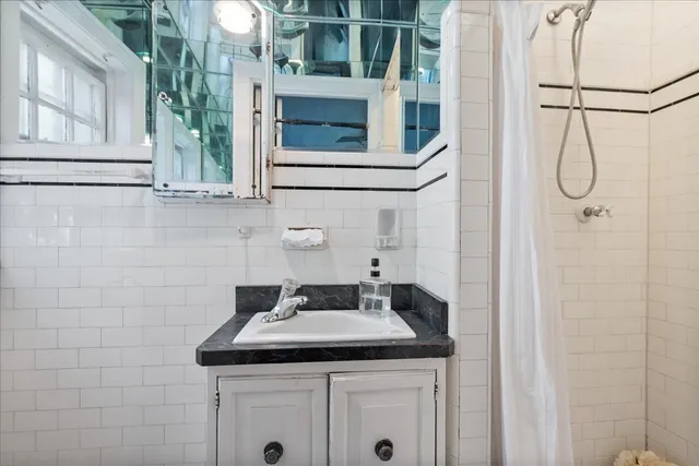 a bathroom with a sink and mirror