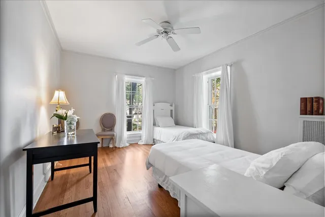 a bedroom with a bed window and couch